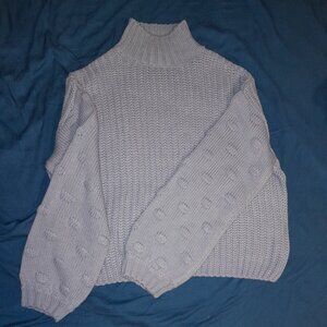 Blue turtleneck knit sweater